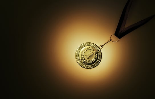 Gold medal on a black background photo