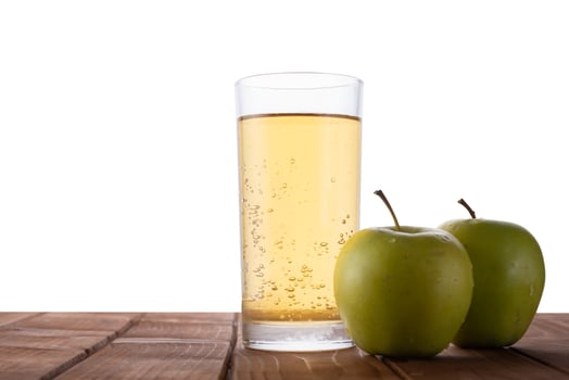 Apple juice on a table with isolated background photo