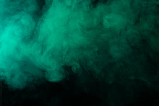 Green smoke on black background photo
