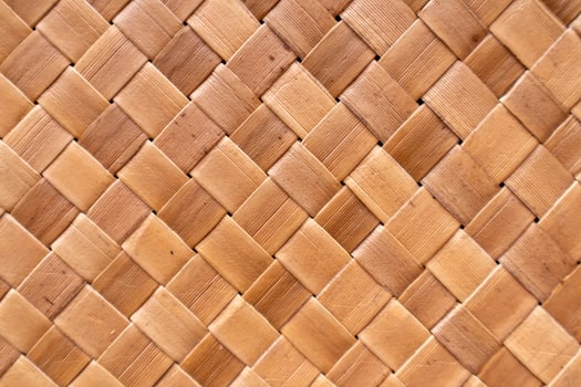 Brown coconut leaf weaving pattern. Mat made from woven dry coconut leaves. photo
