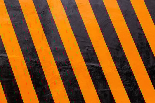 Black and yellow stripes on the road divider wall. Roadside safety concrete. photo