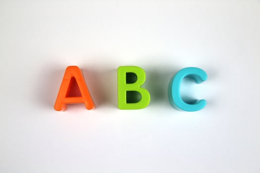 Bright and colorful letters of the English alphabet on a white background. Learning concept photo