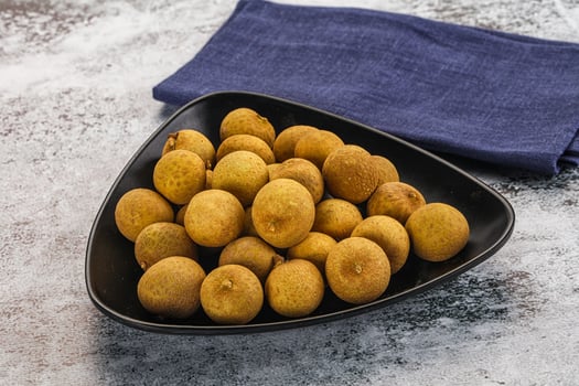 A black bowl filled with kiwis photo