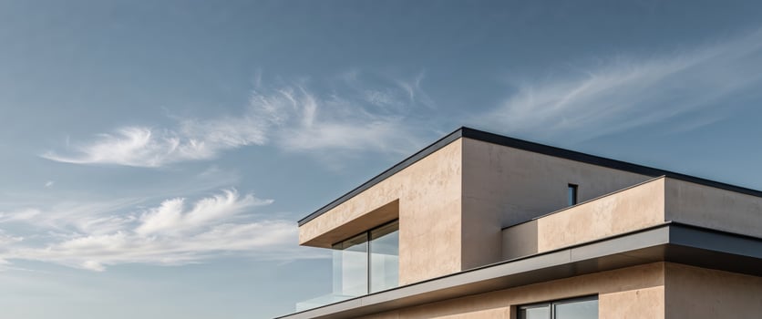 A modern house with a large window and a sky background photo