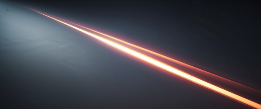 A long line of light coming from a bright object photo