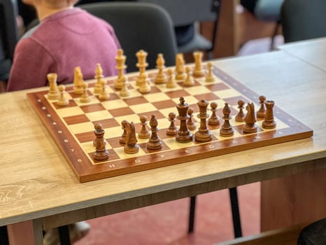 Chessboard with figures during a chess tournament in a school photo