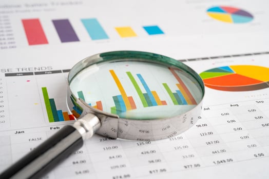 Magnifying glass on charts graphs paper. Financial development, Banking Account, Statistic, Investment Analytic photo