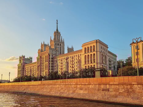 Skyscraper on the Moskva River, golden evening sunset. photo
