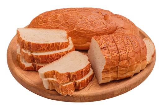 Bread whole and sliced on a wooden round board isolate on white. Food, bread. photo