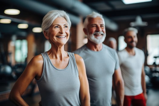 Active and joyful elderly individuals enjoying themselves in the gym photo