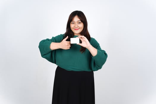Asian woman holding a white card and showing thumbs up photo