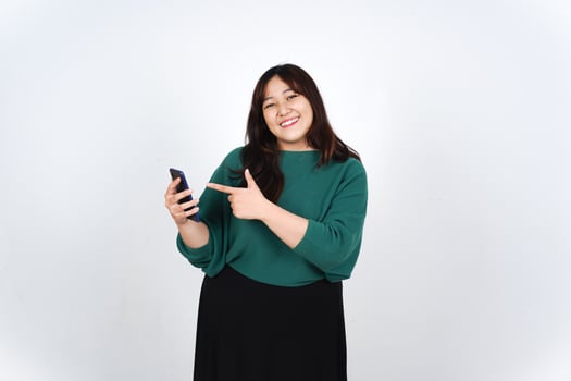 Asian woman holding a smart phone and smiling photo