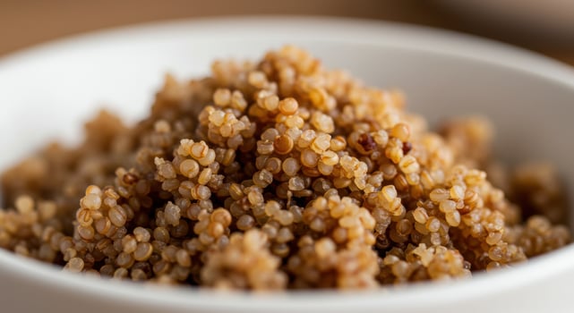 Delicious fluffy quinoa, served in a white bowl, ready for a healthy and satisfying meal. photo