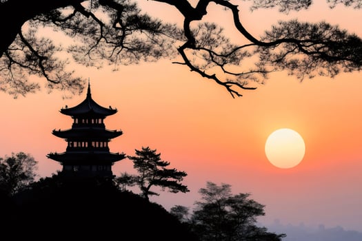 Chinese pagoda silhouette at sunset under a pine tree photo