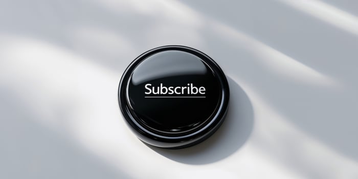 Subscribe button on white surface photo