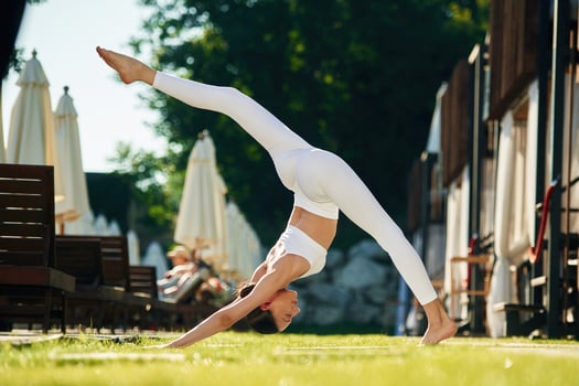 Long legs. Young woman in yoga clothes, is ,outdoors photo