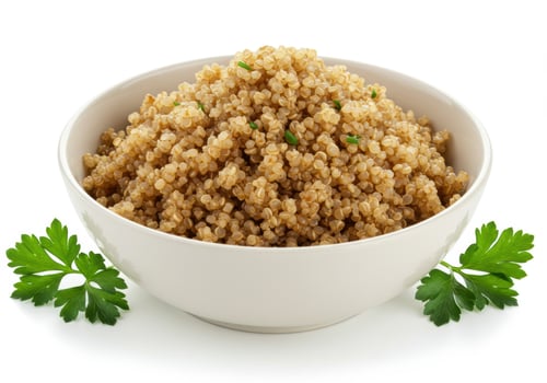 A bowl of fluffy, cooked quinoa is presented, ready for a healthy and delicious meal. photo
