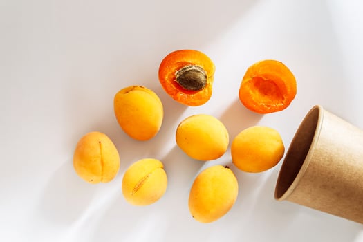 Bowl of oranges and a half eaten orange photo