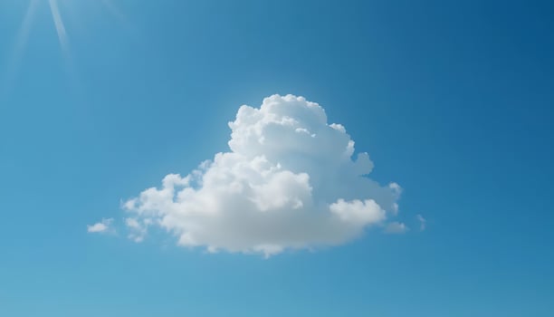 Solitary Cloud Floating in a Blue Sky on Sunny Day photo