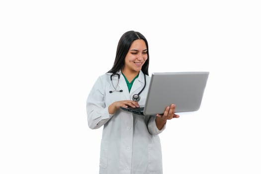 Latin female doctor working with laptop on white background photo