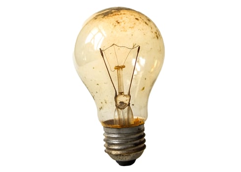 Old light bulb isolated on white background photo