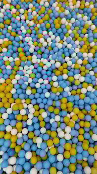 a large pile of blue and yellow balls photo