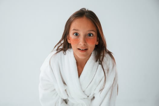 Positive look. With ,eye patches. Conception of beauty and self care. Young girl is in the studio photo