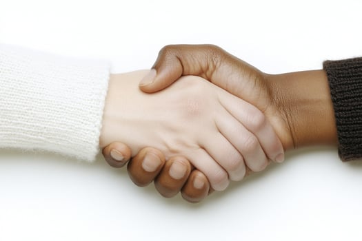 Two people shaking hands over a white background photo