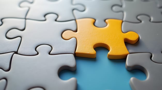 Puzzle Pieces with One Yellow Piece and Blue Void photo