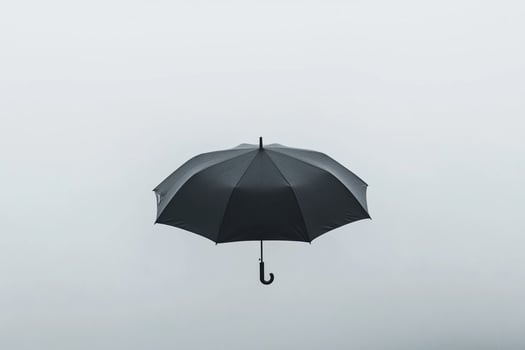 An umbrella is seen in the foggy sky photo