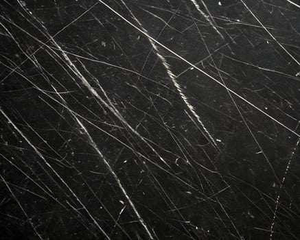 random scratch marks isolated on black background photo
