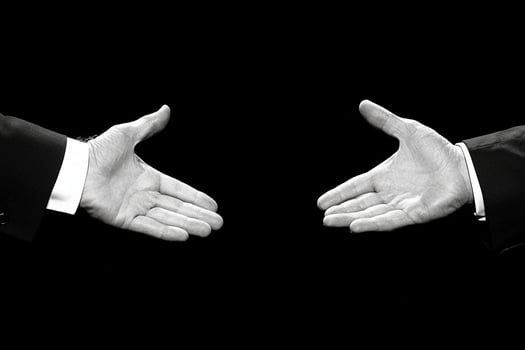 Two hands reaching out to each other photo