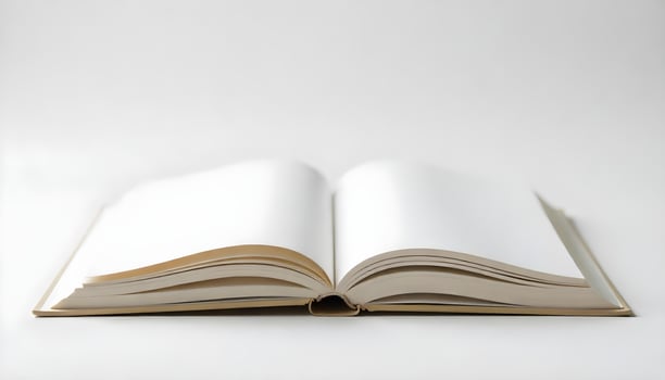 An open book with blank pages is seen on a white surface, ready for creative ideas. photo