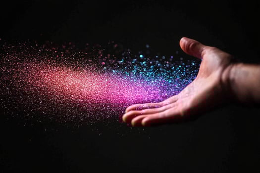 A hand is holding a colorful powder photo