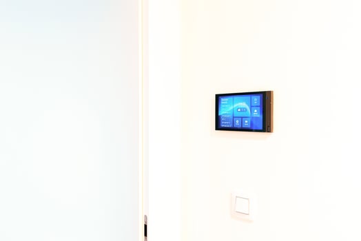 Prague, Czech republic - December 1, 2024. Close-up of a wall-mounted Akuvox indoor station photo