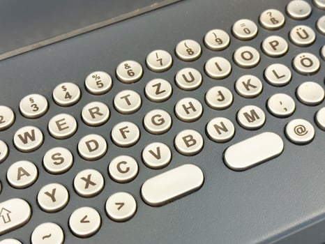 Retro german keyboard layout with circular keys and symbols photo