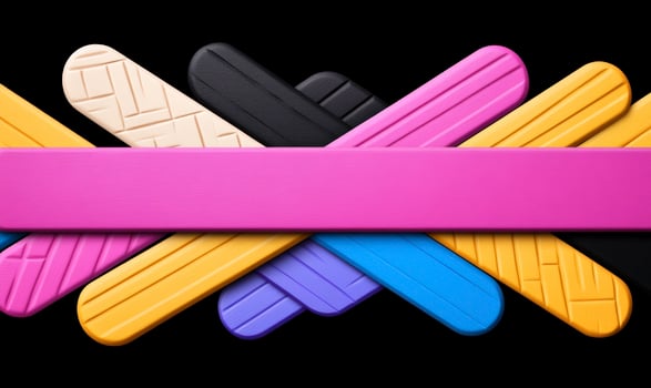 A group of colorful plastic sticks on a black background photo
