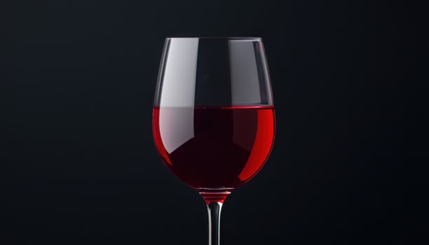 Red wine glass on dark background beverage photography artistic shot minimalist style photo