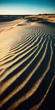 Waves of sand create patterns under the golden sun photo