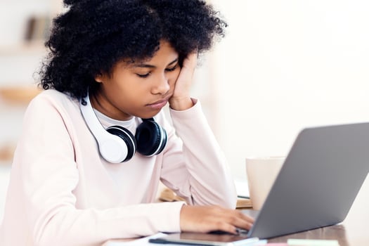 Sleepy African School Girl Sleeping Sitting At Laptop During Online Class Learning From Home. Selective Focus photo