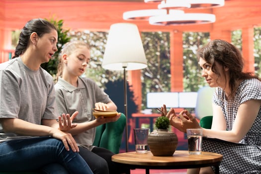 Therapist suggests an insightful self help book designed to address teen depression, guiding girl through recovery with effective coping techniques and deeper emotional understanding. photo