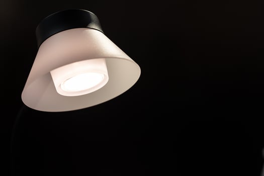 modern pendant lights hanging from a dark ceiling. Copy space. photo