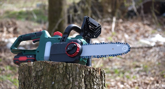 Modern cordless chainsaw is displayed, ready for use in various woodworking and forestry tasks. photo
