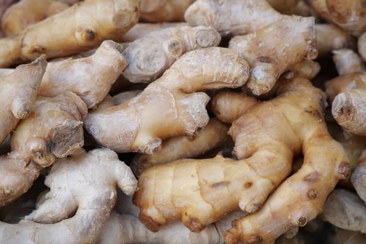 Fresh ginger roots displayed at a local market photo