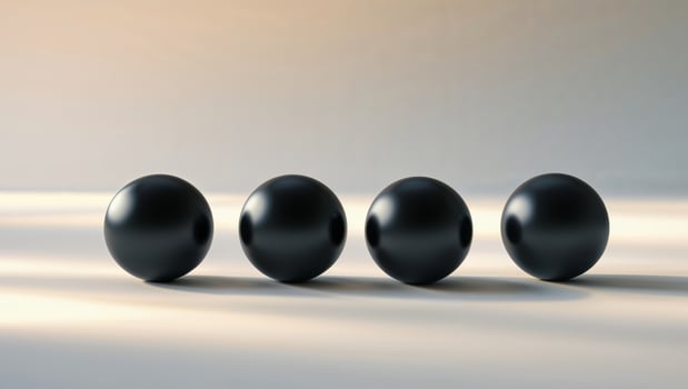 Four black round objects on a white surface photo