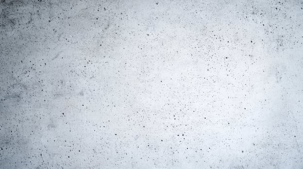 Light concrete wall with porous surface featuring tiny holes and a slightly speckled texture in a minimal gray finish. photo