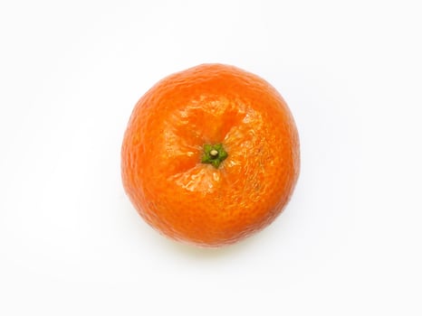 A vibrant, single mandarin orange sits centrally against a stark white background. Its textured peel and juicy appearance suggest freshness and health. photo