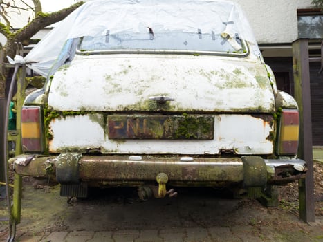 Close Up of Rusty Abandoned Car with Moss photo