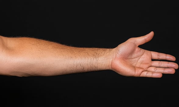 A man's arm is stretched out to the side photo