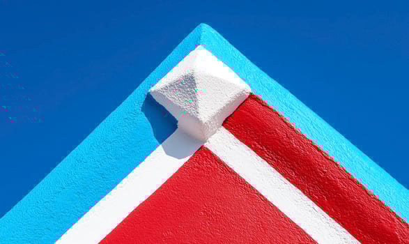A close up of a red and white painted roof photo